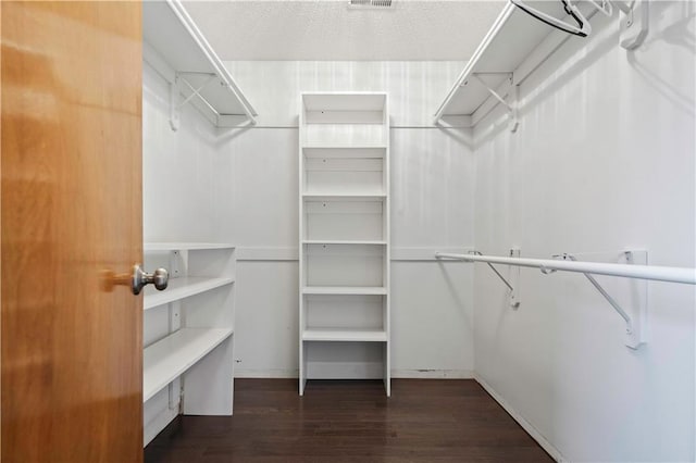 spacious closet with wood finished floors