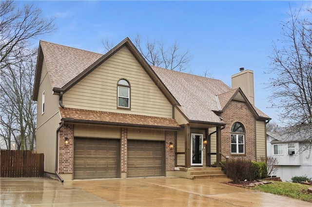 view of front of property with a shingled roof, a chimney, fence, and brick siding