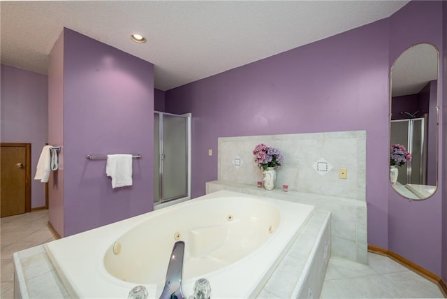 full bath featuring baseboards, a whirlpool tub, a stall shower, tile patterned floors, and a textured ceiling