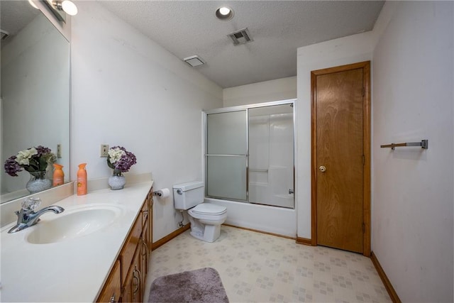 full bathroom featuring visible vents, toilet, a textured ceiling, baseboards, and vanity
