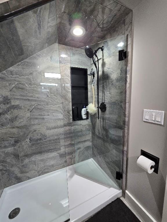 bathroom with a shower stall