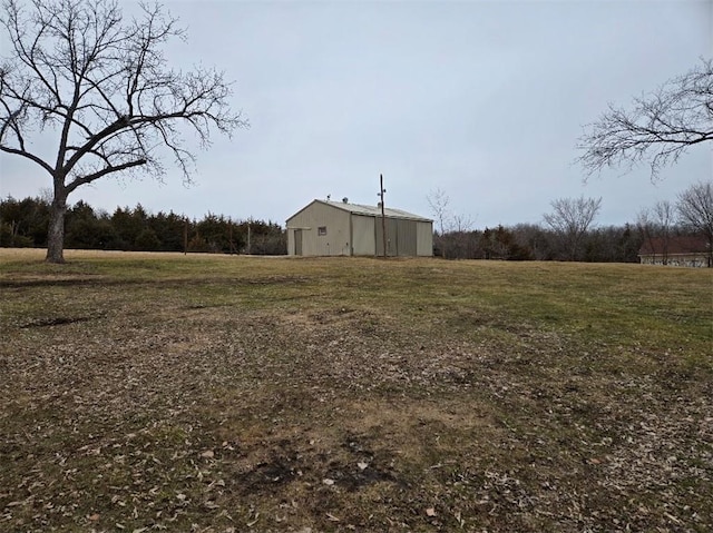 view of yard featuring an outbuilding and an outdoor structure