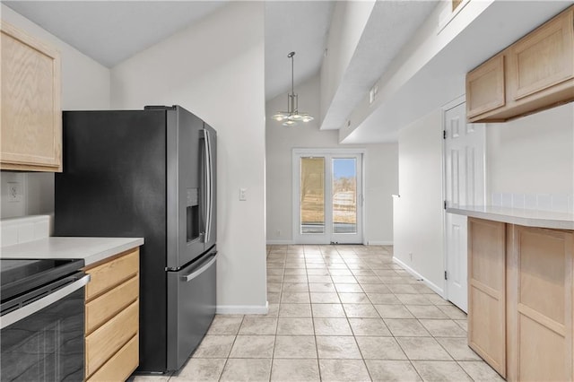 kitchen featuring lofted ceiling, light tile patterned flooring, light countertops, and light brown cabinetry