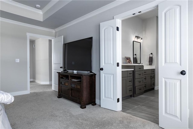 bedroom with light carpet, baseboards, and ornamental molding