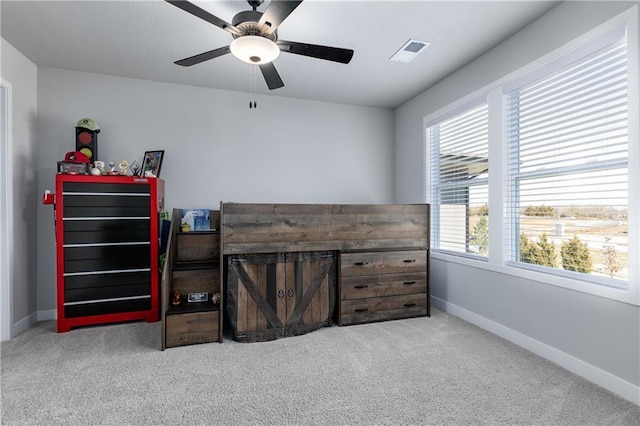 bedroom with baseboards, visible vents, carpet floors, and ceiling fan