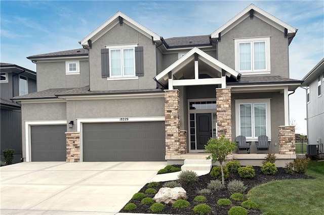 craftsman house featuring an attached garage and stucco siding