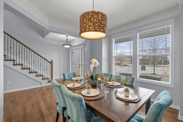 dining area with crown molding, stairway, wood finished floors, and baseboards