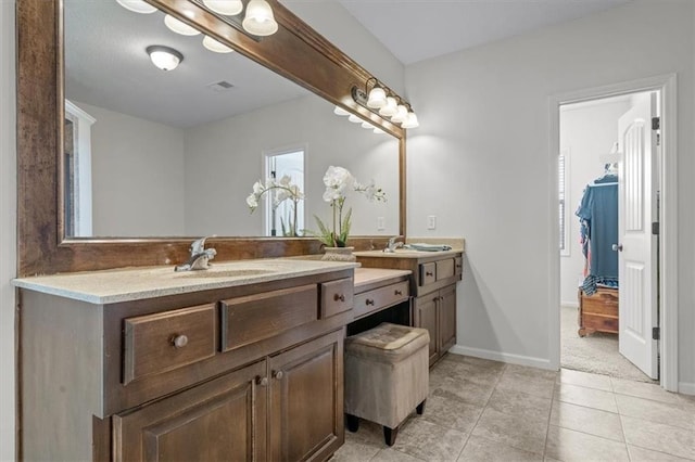 full bathroom with vanity, visible vents, baseboards, and tile patterned flooring