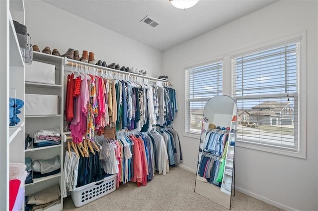 walk in closet featuring carpet and visible vents