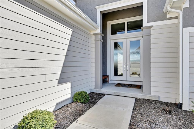 view of exterior entry featuring french doors