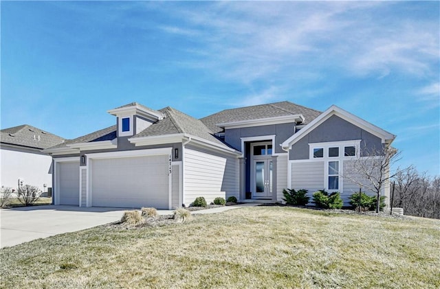 view of front facade featuring an attached garage, concrete driveway, and a front yard