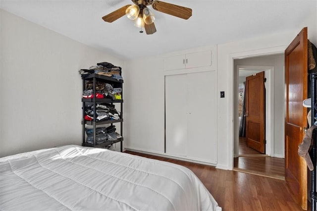 bedroom with a ceiling fan and wood finished floors