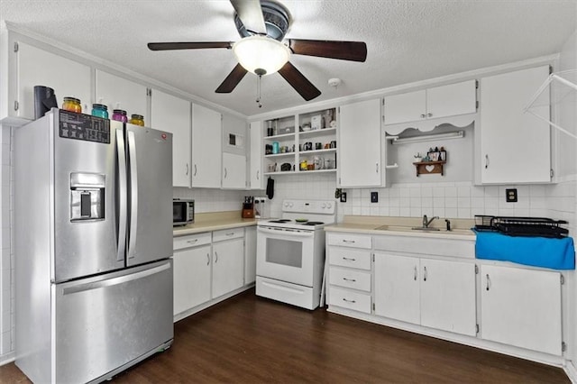 kitchen with open shelves, appliances with stainless steel finishes, light countertops, and white cabinets