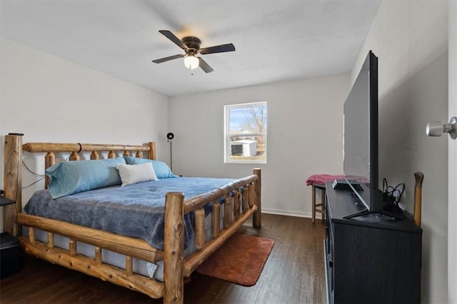 bedroom with dark wood finished floors, baseboards, and ceiling fan