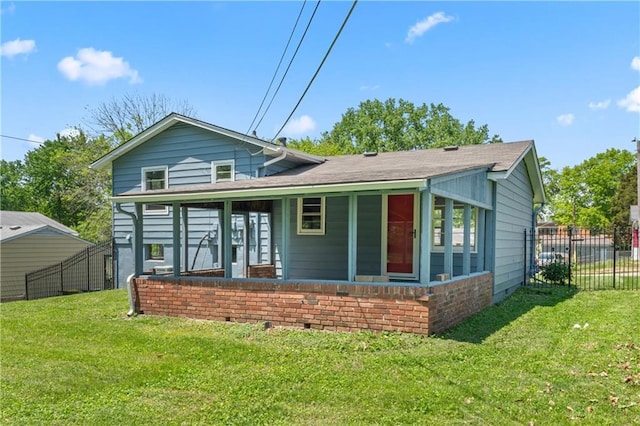 back of property with a shingled roof