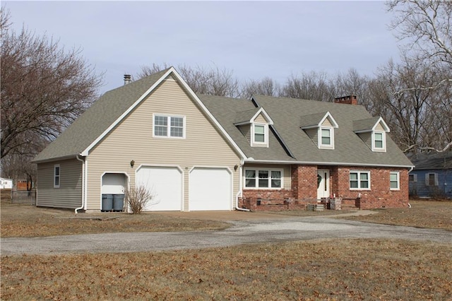 view of front of property with a garage, brick siding, driveway, and roof with shingles