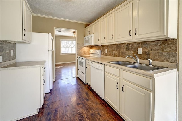 kitchen featuring crown molding, dark wood finished floors, backsplash, a sink, and white appliances