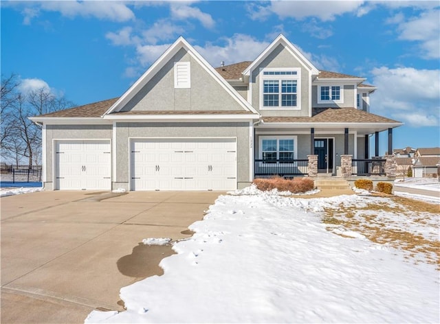 view of front of property with a porch, driveway, an attached garage, and stucco siding