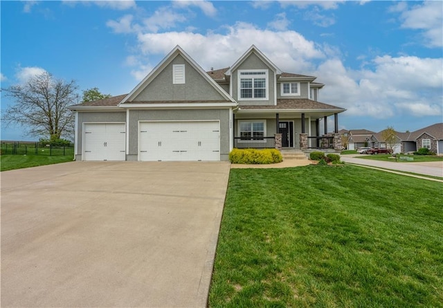 craftsman house featuring an attached garage, a front lawn, stucco siding, concrete driveway, and covered porch