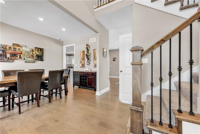 interior space with visible vents, recessed lighting, light wood-style flooring, and stairway