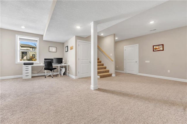 office featuring light colored carpet, recessed lighting, and a textured ceiling