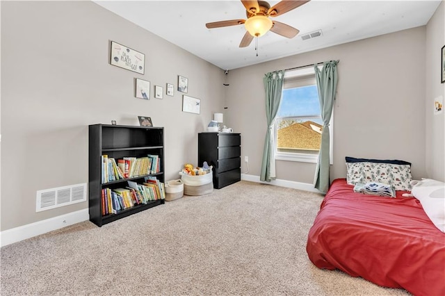 bedroom with carpet flooring, baseboards, visible vents, and ceiling fan