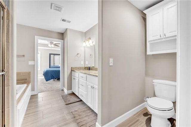 full bathroom featuring visible vents, baseboards, toilet, and vanity
