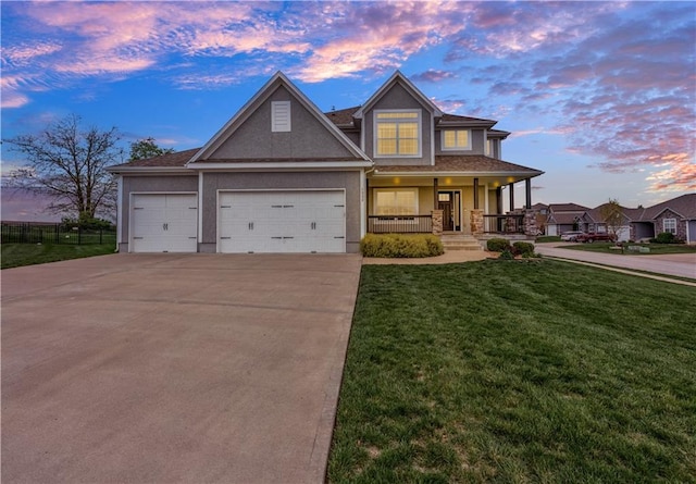 craftsman-style house with an attached garage, stucco siding, a porch, a front yard, and concrete driveway