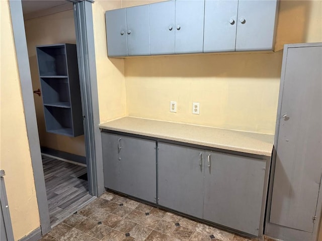 kitchen with gray cabinets and light countertops