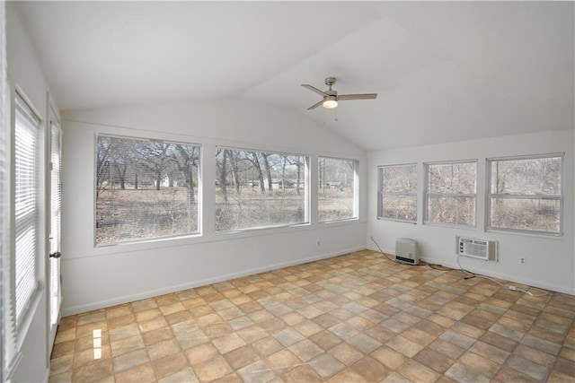 unfurnished sunroom featuring a ceiling fan, a wall unit AC, and vaulted ceiling