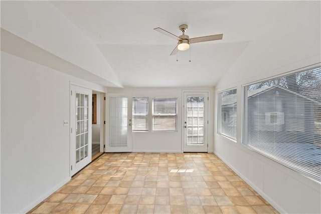 unfurnished sunroom featuring lofted ceiling and ceiling fan