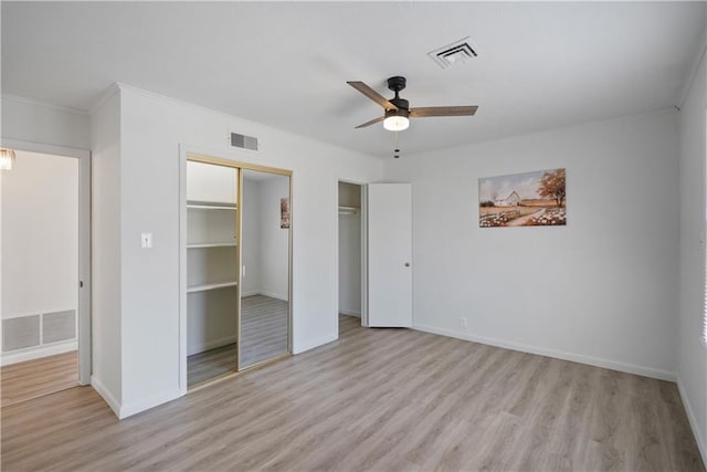 unfurnished bedroom featuring light wood-type flooring and visible vents