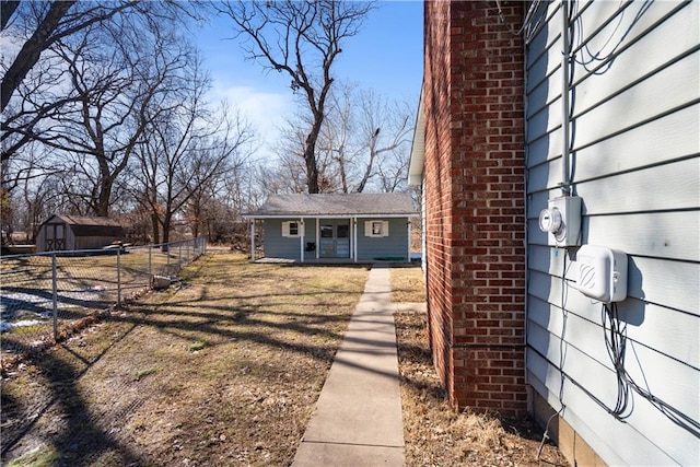 exterior space with an outbuilding and fence