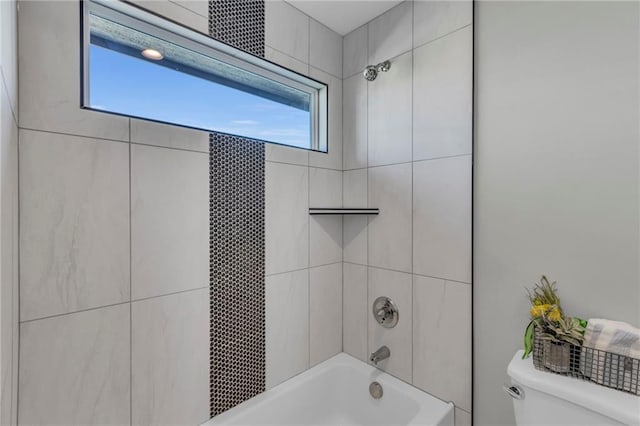 bathroom with toilet and bathtub / shower combination