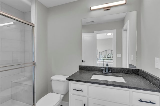 full bathroom with visible vents, vanity, a shower stall, and toilet