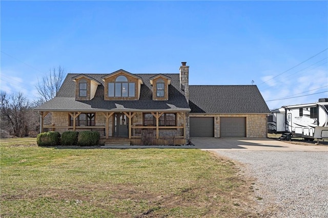 view of front facade featuring gravel driveway, a porch, a garage, and stone siding