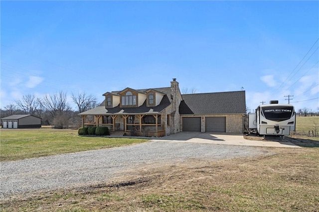 view of front of house with a porch, gravel driveway, a front yard, a garage, and a chimney