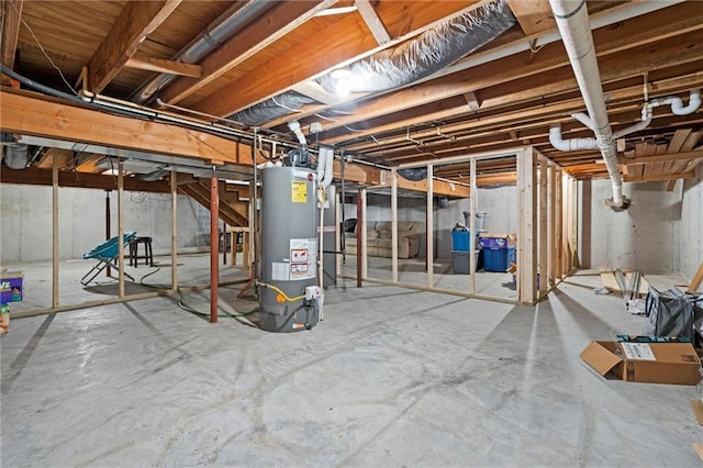 unfinished basement featuring gas water heater