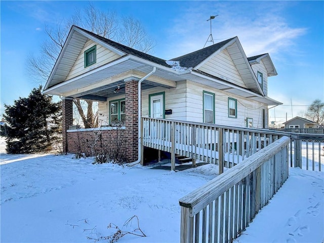 view of front of home with brick siding