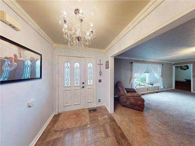 foyer featuring baseboards, a chandelier, and crown molding