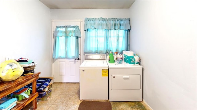 washroom featuring laundry area and washing machine and clothes dryer