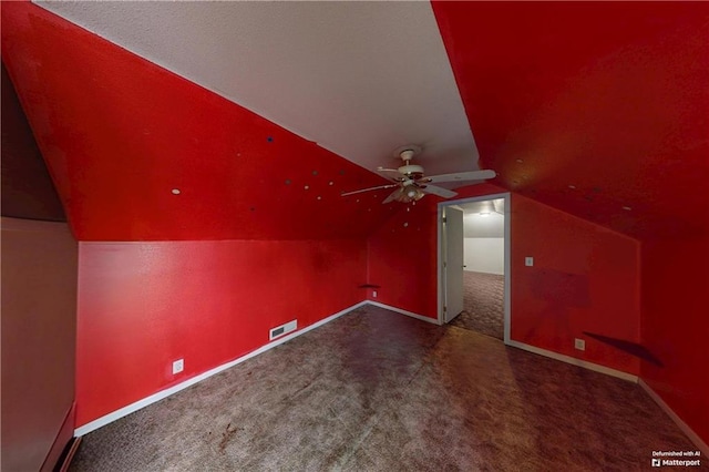 additional living space with lofted ceiling, carpet flooring, visible vents, and baseboards