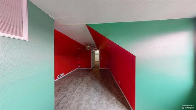 additional living space with visible vents, baseboards, a ceiling fan, lofted ceiling, and carpet