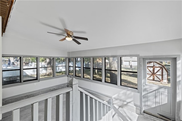 interior space featuring a sunroom, vaulted ceiling, and a ceiling fan