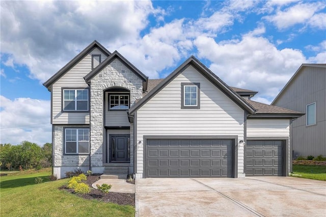 view of front of house featuring a garage, a shingled roof, stone siding, driveway, and a front lawn