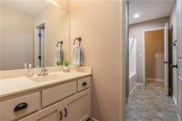 full bathroom featuring shower / washtub combination, vanity, and baseboards