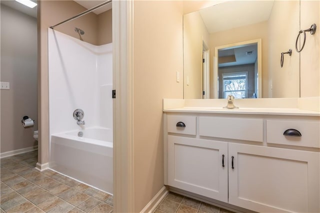 full bathroom featuring vanity, toilet, shower / bathtub combination, and baseboards