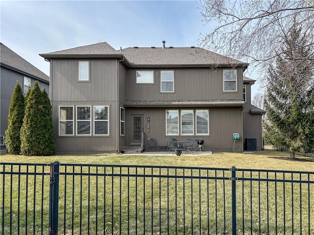 back of house with a patio, a shingled roof, fence private yard, central air condition unit, and a lawn