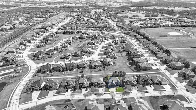 birds eye view of property with a residential view