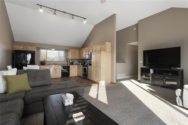 living room with baseboards, visible vents, dark colored carpet, and high vaulted ceiling